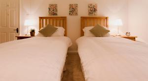 Posteľ alebo postele v izbe v ubytovaní Blue Bell Cottage
