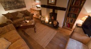 an overhead view of a living room with a fireplace at Blue Bell Cottage in Ollerton