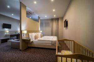 Postel nebo postele na pokoji v ubytování Košice Hotel