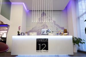 a white counter top with a sign on it at 12 Revay Hotel in Budapest