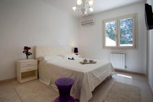 En eller flere senge i et værelse på Villa Maria Clara by Perle di Puglia + 26 billeder