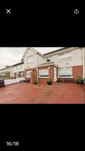 two pictures of a building with a brick courtyard at Gracefield in Artane