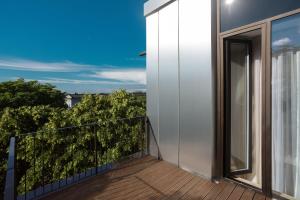 a balcony with a view of a building at Centennial Nexus Hotel Tallinn in Tallinn