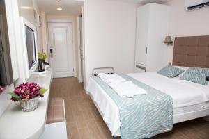 Кровать или кровати в номере Asli Hotel