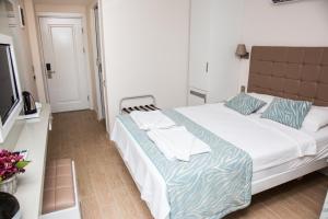 Кровать или кровати в номере Asli Hotel