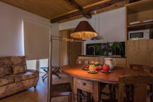 a kitchen with a table with fruit on it at Quinta Do Acipreste (Antiga Quinta Da Torre) in Lamego