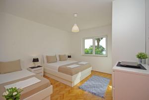 Ένα ή περισσότερα κρεβάτια σε δωμάτιο στο Beachfront Apartment