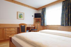 Ένα ή περισσότερα κρεβάτια σε δωμάτιο στο Mountain B&B - La Scalira