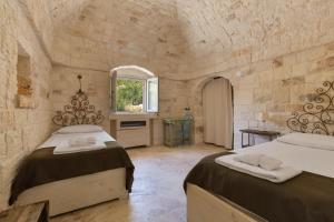 מיטה או מיטות בחדר ב-La Dialma by BarbarHouse