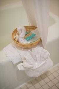 a basket of towels and a basket of towels at Motel 8 Rock Springs in Rock Springs