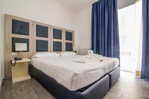 Posteľ alebo postele v izbe v ubytovaní Vatican Relais Rome