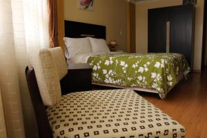 Säng eller sängar i ett rum på Hotel Joshed Imperial