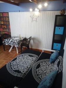 a living room with a table and a couch and a table and a tableablish at Loft Centro Histórico Arucas in Arucas