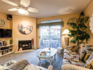 a living room with a couch and a coffee table at Private Resort Community Surrounded By Mountains w/3 Pool-Spa Complexes, ALL HEATED & OPEN 24/7/365! in Phoenix