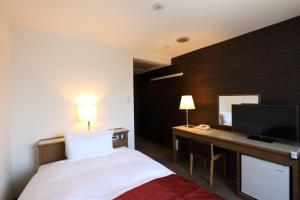 Krevet ili kreveti u jedinici u objektu Hotel Leon Hamamatsu