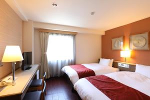 Krevet ili kreveti u jedinici u objektu Hotel Leon Hamamatsu