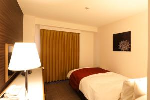Krevet ili kreveti u jedinici u objektu Hotel Leon Hamamatsu