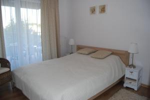 Posteľ alebo postele v izbe v ubytovaní Apartament Piaskowy Polanki Park + 37 fotografií