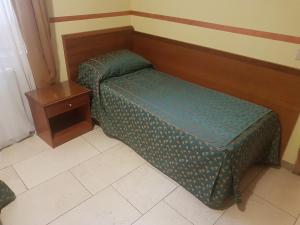 Postel nebo postele na pokoji v ubytování B&B Antica Trattoria