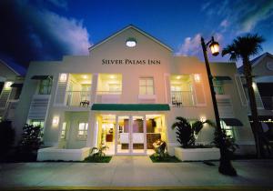a building with a sign that reads silver palms inn at Silver Palms Inn in Key West