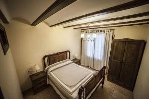Cama o camas de una habitación en Apartamentos Cine Capicol