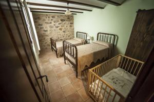 Cama o camas de una habitación en Apartamentos Cine Capicol