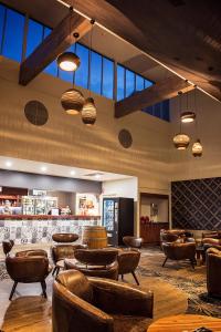 a restaurant with chairs and tables in a room at Yarrawonga Mulwala Golf Club in Yarrawonga