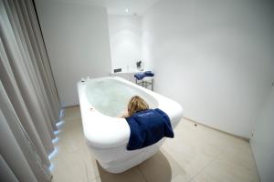 A bathroom at Relais & Châteaux Le Brittany & Spa