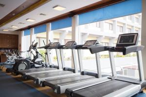 a row of cardio machines in a gym at Dolphin Hotel in Visakhapatnam