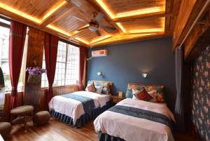 Rúm í herbergi á Floral Hotel · Baihui Living Zhangjiajie