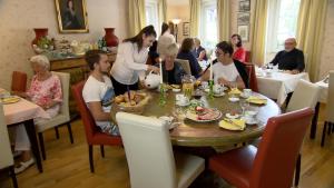 a group of people sitting around a table in a restaurant at Hotel Gästehaus Priester in Limburg an der Lahn +35 photos