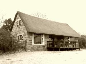 a black and white photo of a log cabin at Blarney Stone Cottage in Killarney