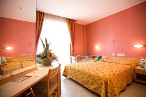 Postel nebo postele na pokoji v ubytování Hotel Junior