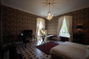 Postel nebo postele na pokoji v ubytování Liepupe Manor