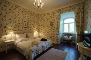 Postel nebo postele na pokoji v ubytování Liepupe Manor