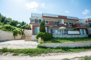 a building with a staircase in front of it at Momchil Villas in Balchik