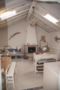 a living room with a fireplace and a chandelier at Casa Leandra con jacuzzi in Adeje