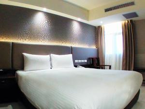 Letto o letti in una camera di KDM Hotel