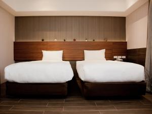 Letto o letti in una camera di KDM Hotel