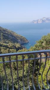 a view of the ocean from a balcony at Acquamarina Accommodation in Massa Lubrense