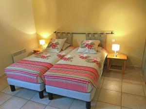 a bedroom with two beds and two lamps on tables at Tranquil Villa in Bargemon with Private Pool in Bargemon