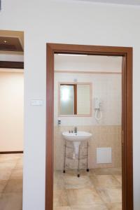 a bathroom with a sink and a mirror at Agriturismo Fasano in Cassano delle Murge