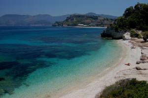 a view of a beach with the blue water at Residence Capobianco in Portoferraio