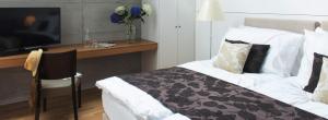 Uma cama ou camas num quarto em Barracuda