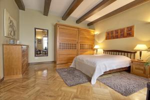 Кровать или кровати в номере Pilies Apartments