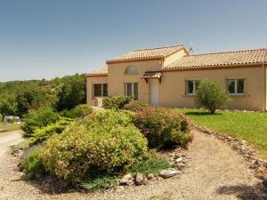 a house with a garden in front of it at Peaceful Villa in Calamane with Private Pool in Calamane