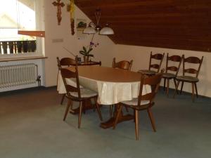 a dining room with a table and chairs at Ferienhaus Bauer mit wunderschönem Panoramablick in Tännesberg