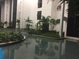 a swimming pool in front of a building at Great Value Family Apartment to Family Apartment @ M-City in Kuala Lumpur