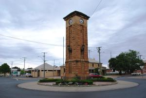 a clock tower in the middle of a street at Imperial Hotel Coonabarabran in Coonabarabran