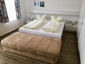 เตียงในห้องที่ Apfelwirt